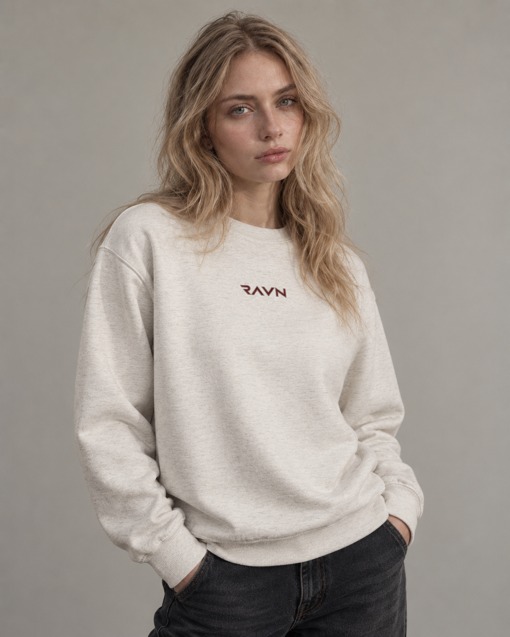 Woman wearing the Sky Crewneck in oatmeal heather