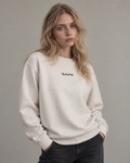 Woman wearing the Sky Crewneck in oatmeal heather