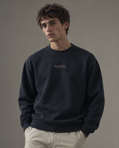 Man wearing the Saga Crewneck in navy