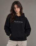 Woman wearing the Tarn Hoodie in black