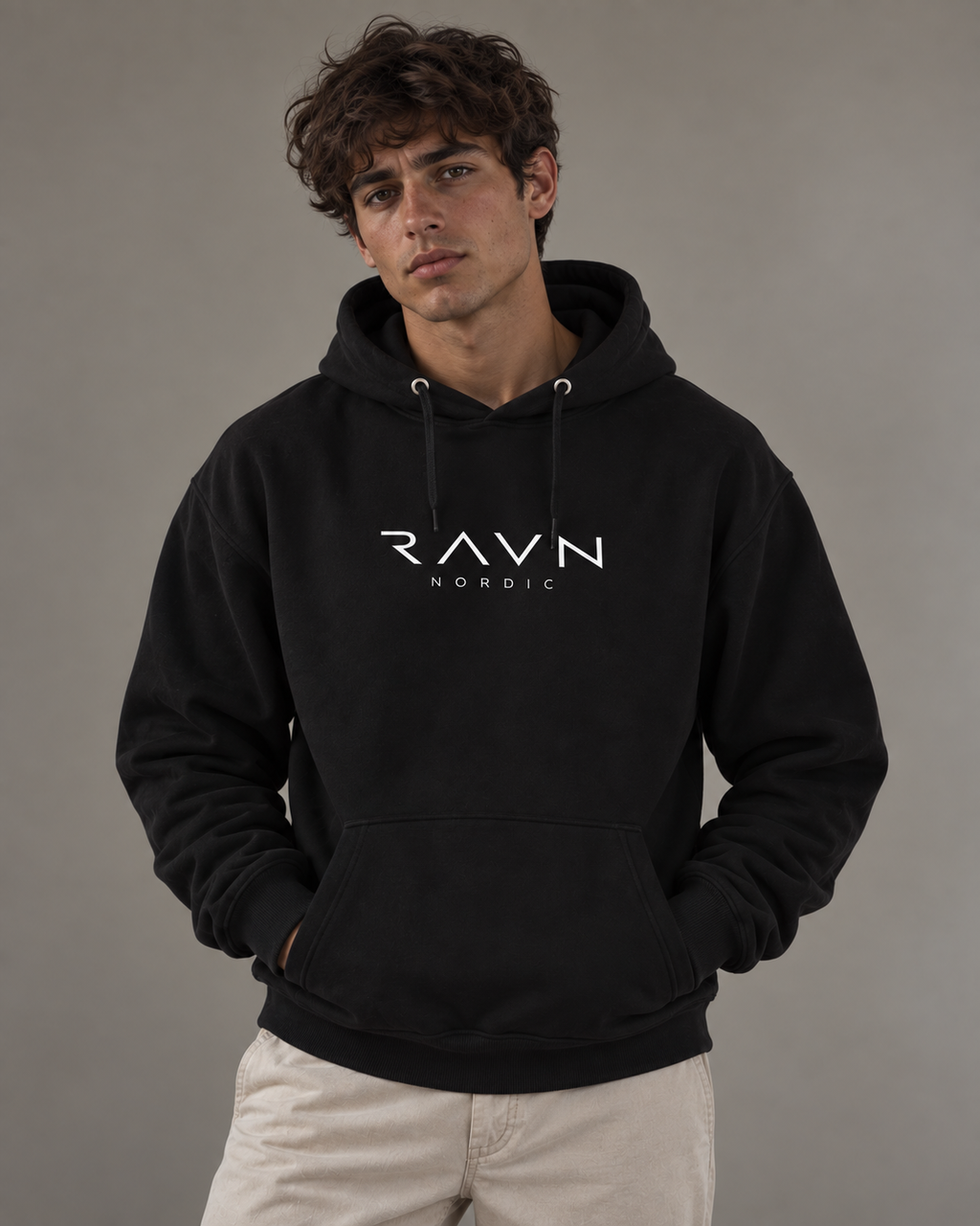 Man wearing the Tarn Hoodie in black