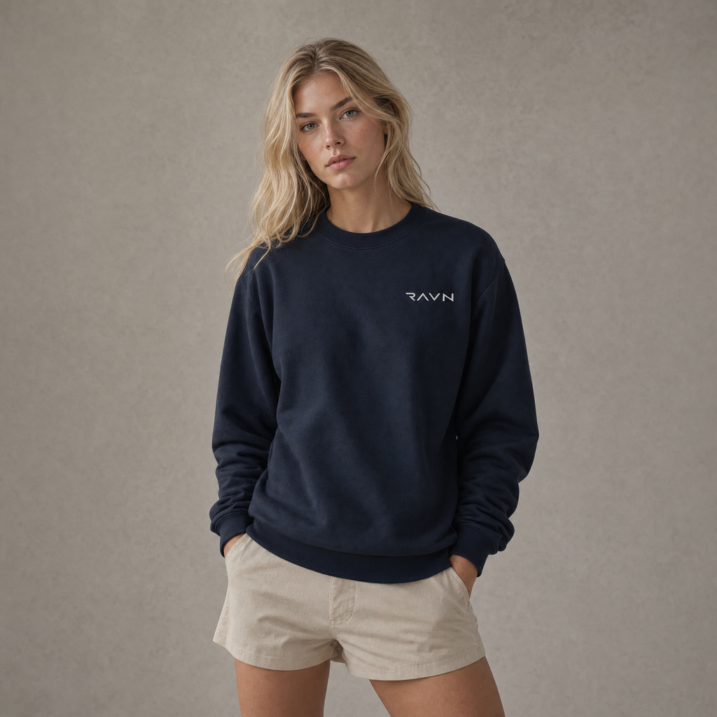 Blonde woman wearing the Beck Crewneck in navy in a studio editorial portrait
