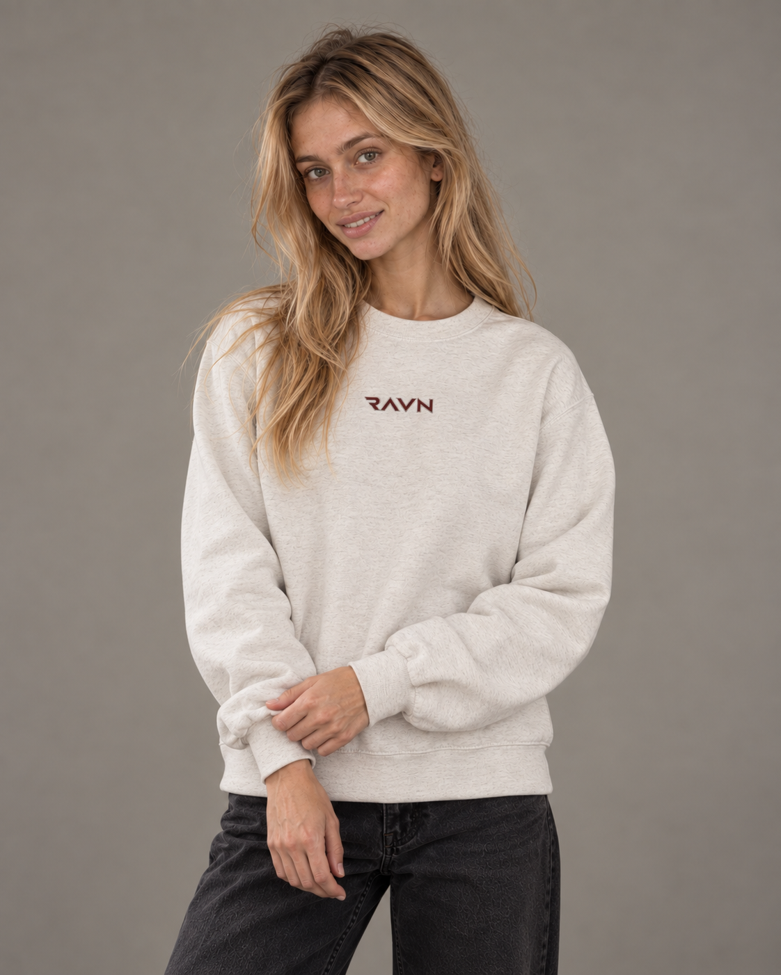 Woman wearing the Sky Crewneck in oatmeal heather