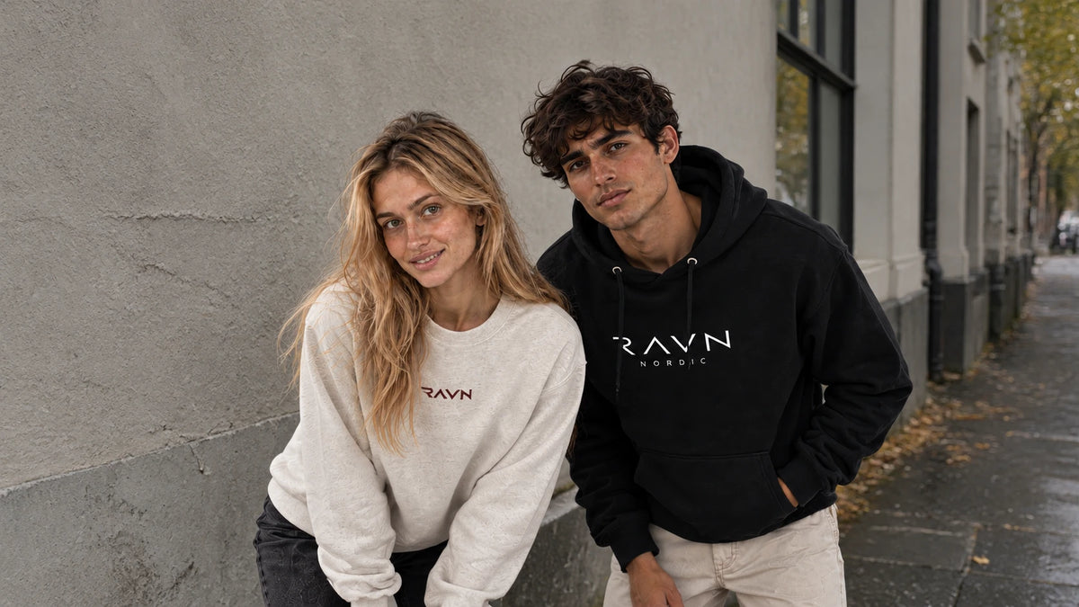 Woman in the Sky Crewneck and man in the Tarn Hoodie on an autumn city street