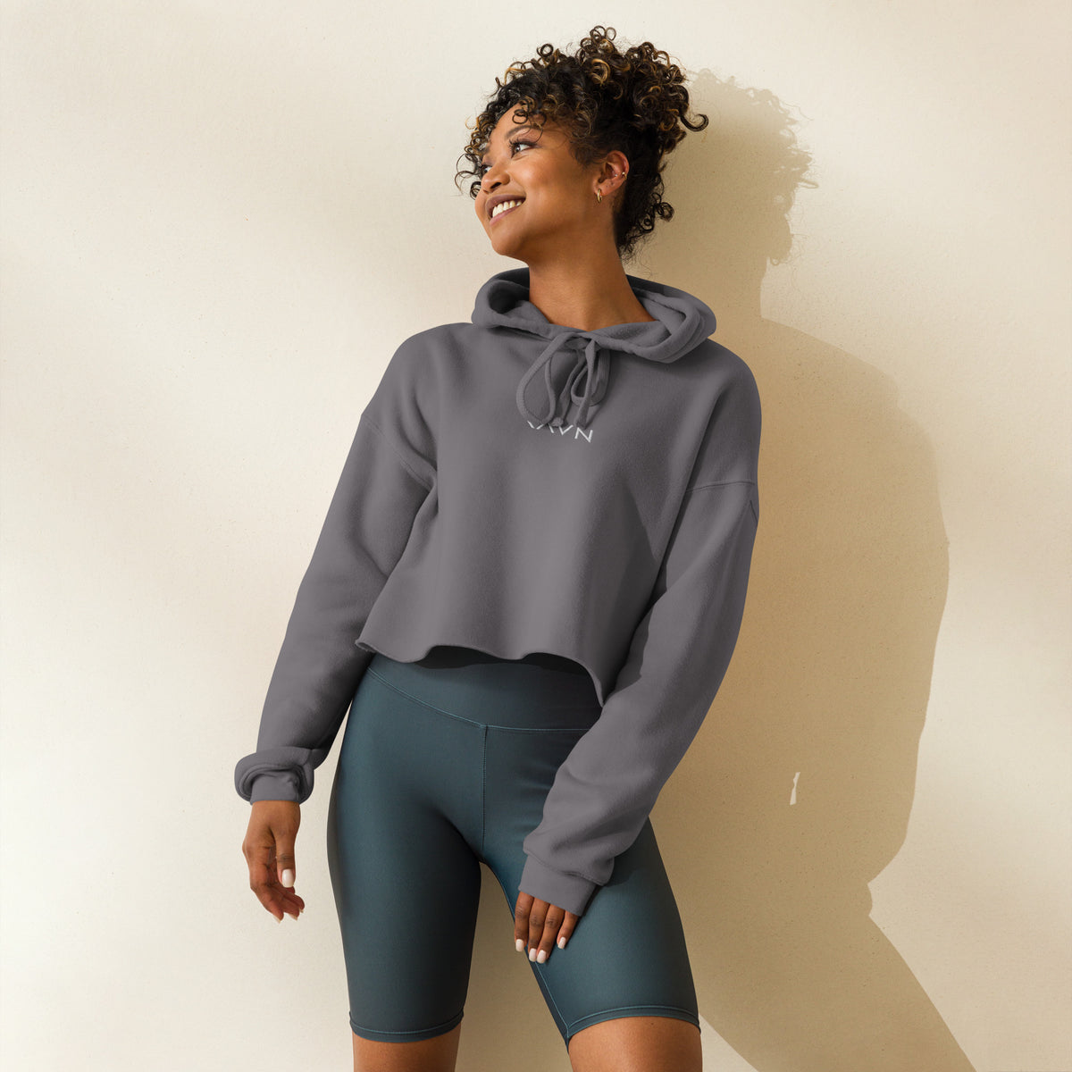 Woman wearing the Wren Cropped Hoodie in storm grey