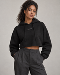 Woman wearing the Wren Cropped Hoodie in Night Black